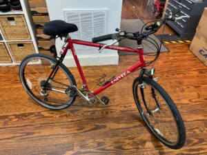 Side view of a vintage Univega Rover Sport bicycle showing the steel frame, drop handlebars, and rear rack.