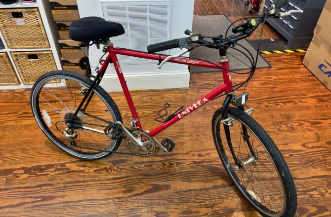 Side view of a vintage Univega Rover Sport bicycle showing the steel frame, drop handlebars, and rear rack.
