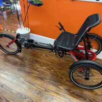 Side view of the Hase Trigo Nexus highlighting the step‑through frame, Nexus drivetrain, and stable rear wheels.