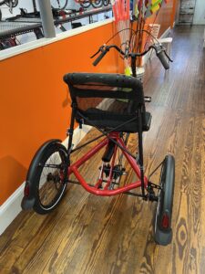 Hase Trigo Up recumbent trike, rear view with upright seat and steering column.