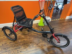 Hase Trigo Up recumbent trike, side view with upright seat and steering column.