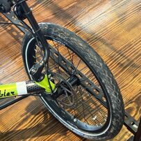 Front view of a TerraTrike E.V.O. showing the front wheel and disc brakes.