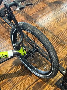 Front view of a TerraTrike E.V.O. showing the front wheel and disc brakes.