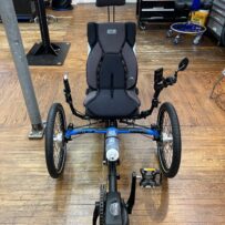 Front view of ICE Adventure recumbent trike rear wheel with 20‑inch tire and Shimano Steps motor.
