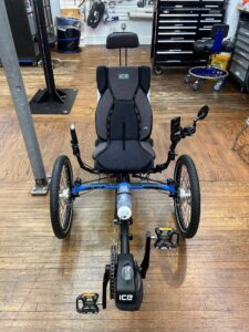 Front view of ICE Adventure recumbent trike rear wheel with 20‑inch tire and Shimano Steps motor.