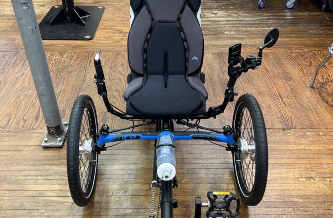 Front view of ICE Adventure recumbent trike rear wheel with 20‑inch tire and Shimano Steps motor.