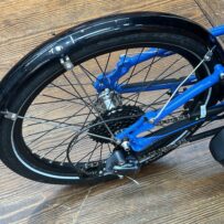 Rear wheel of ICE Adventure recumbent trike rear wheel with 20‑inch tire and Shimano Steps motor.