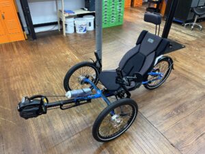 Side view of ICE Adventure recumbent trike rear wheel with 20‑inch tire and Shimano Steps motor.
