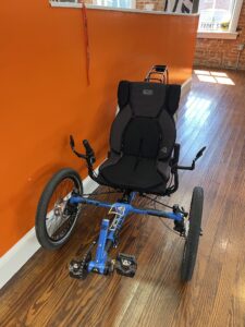 Front view of an ICE Adventure HD 26 FS recumbent trike with Rohloff hub.