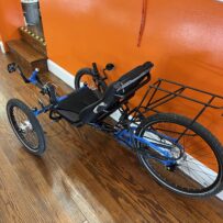 Side view of an ICE Adventure HD 26 FS recumbent trike with Rohloff hub.